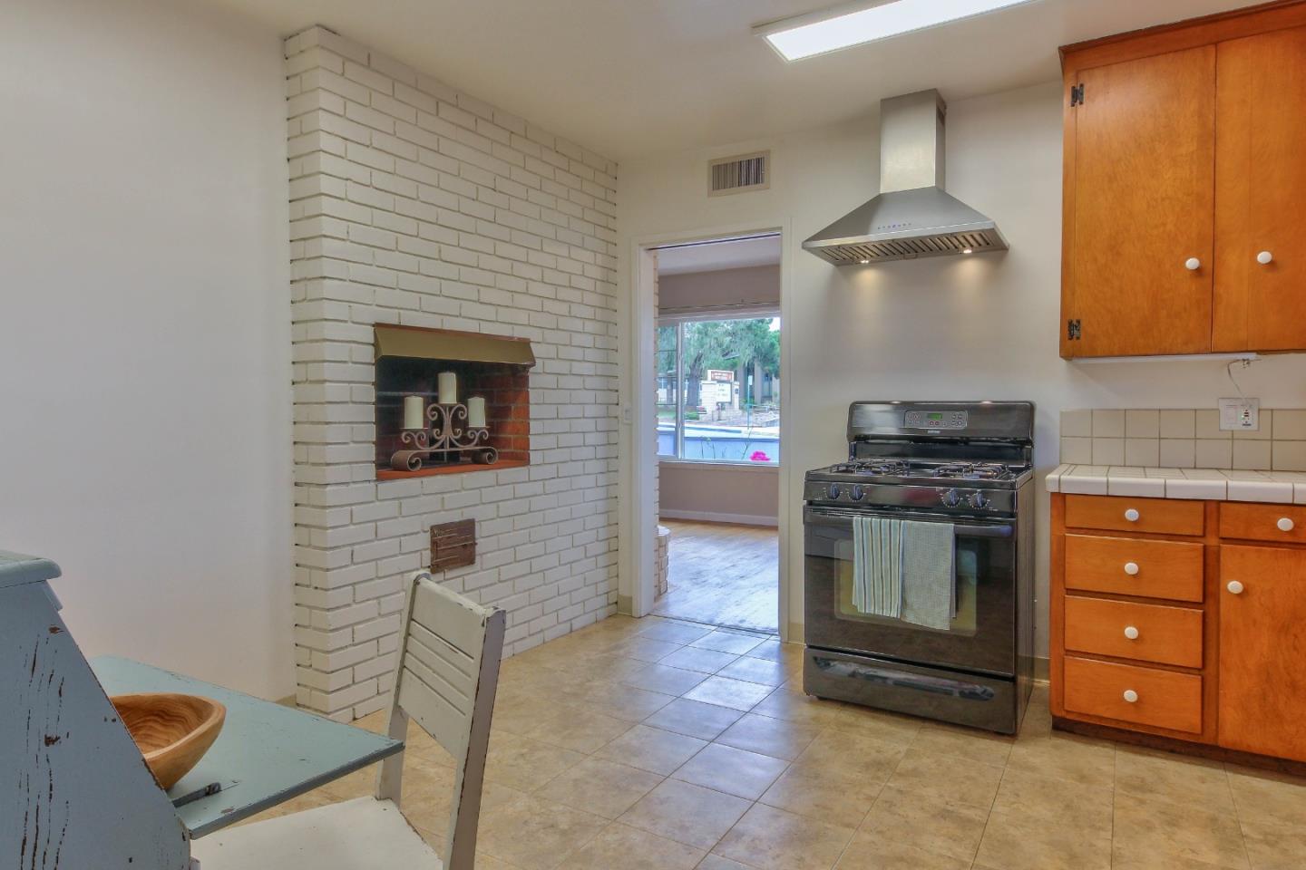 612 Sunset Drive Pacific Grove, CA 93950 - Photo 16 of 37 a kitchen with stainless steel appliances granite countertop a stove and a refrigerator