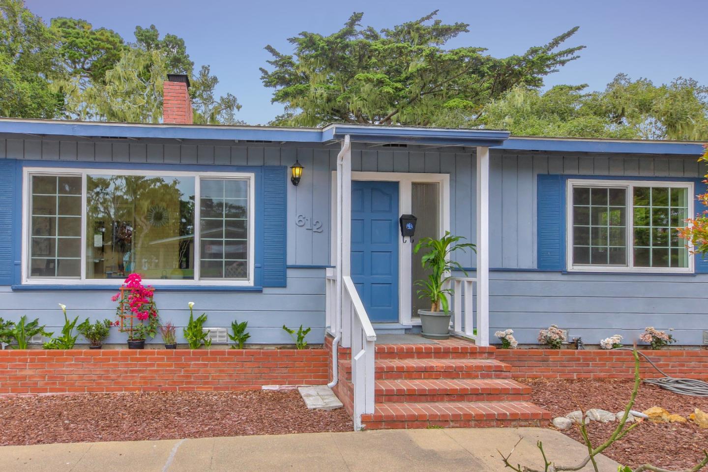 612 Sunset Drive Pacific Grove, CA 93950 - Photo 2 of 37 a front view of a house with garden