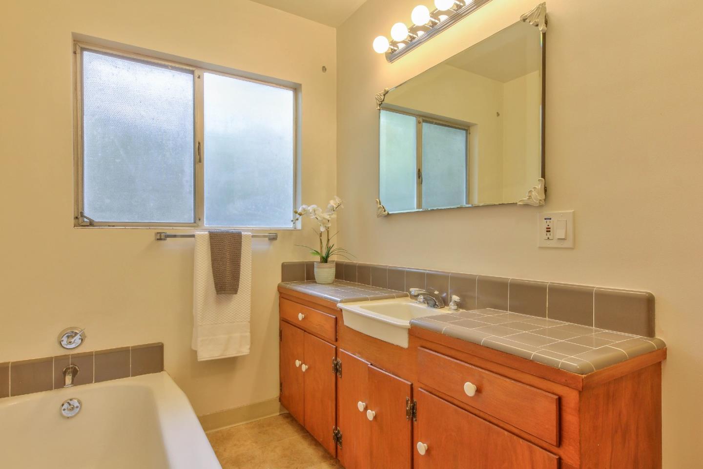 612 Sunset Drive Pacific Grove, CA 93950 - Photo 28 of 37 a bathroom with a sink and a mirror