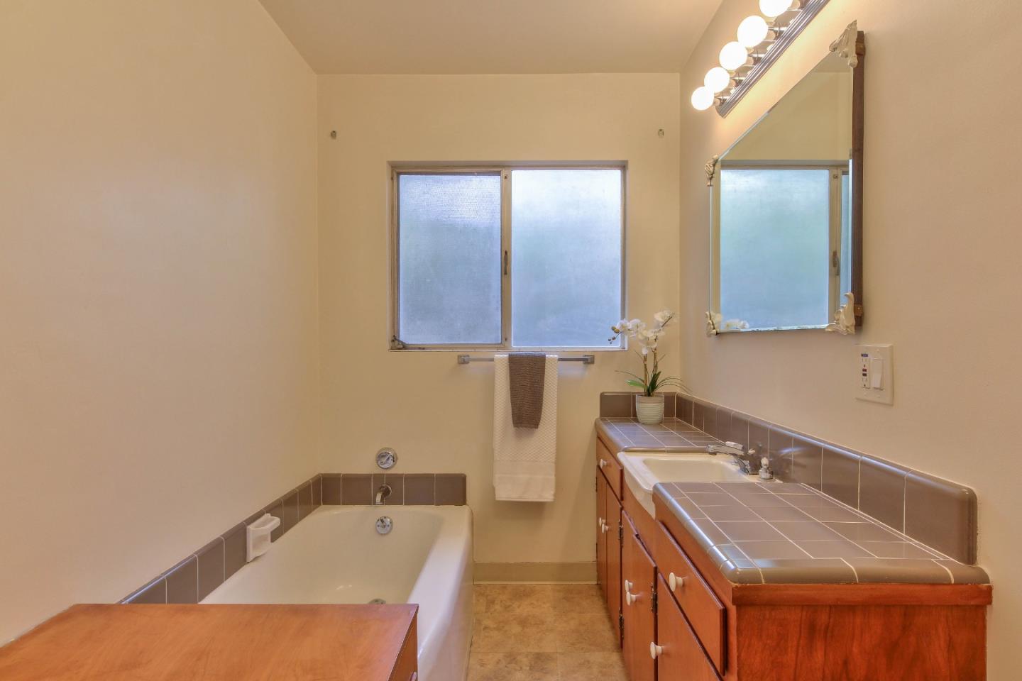 612 Sunset Drive Pacific Grove, CA 93950 - Photo 29 of 37 a bathroom with a sink and a mirror
