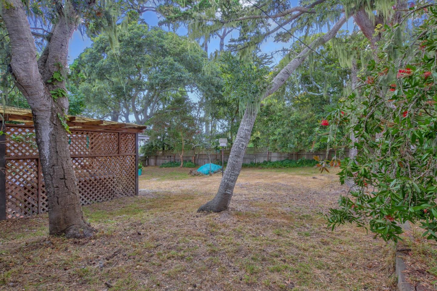 612 Sunset Drive Pacific Grove, CA 93950 - Photo 32 of 37 a backyard of a house with lots of green space