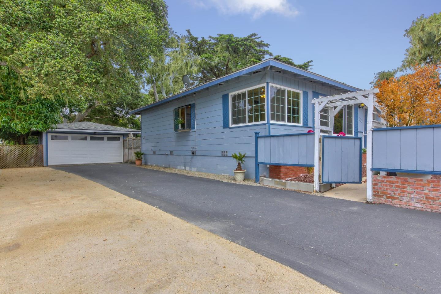 612 Sunset Drive Pacific Grove, CA 93950 - Photo 35 of 37 a front view of a house with a yard and garage