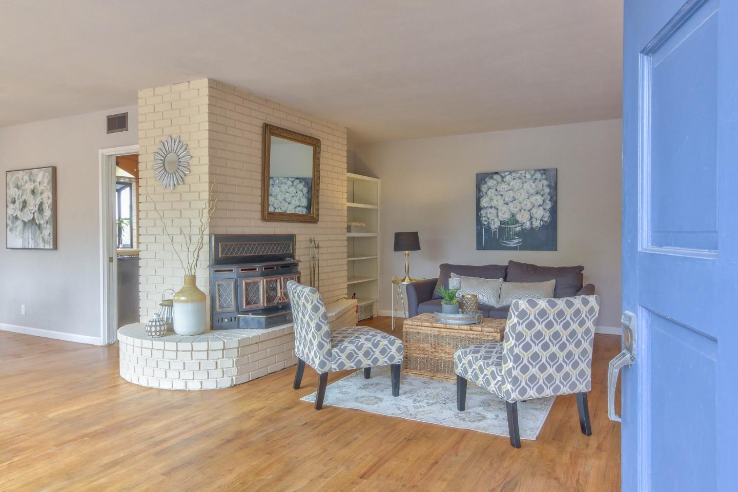 612 Sunset Drive Pacific Grove, CA 93950 - Photo 5 of 37 a living room with furniture and a wooden floor