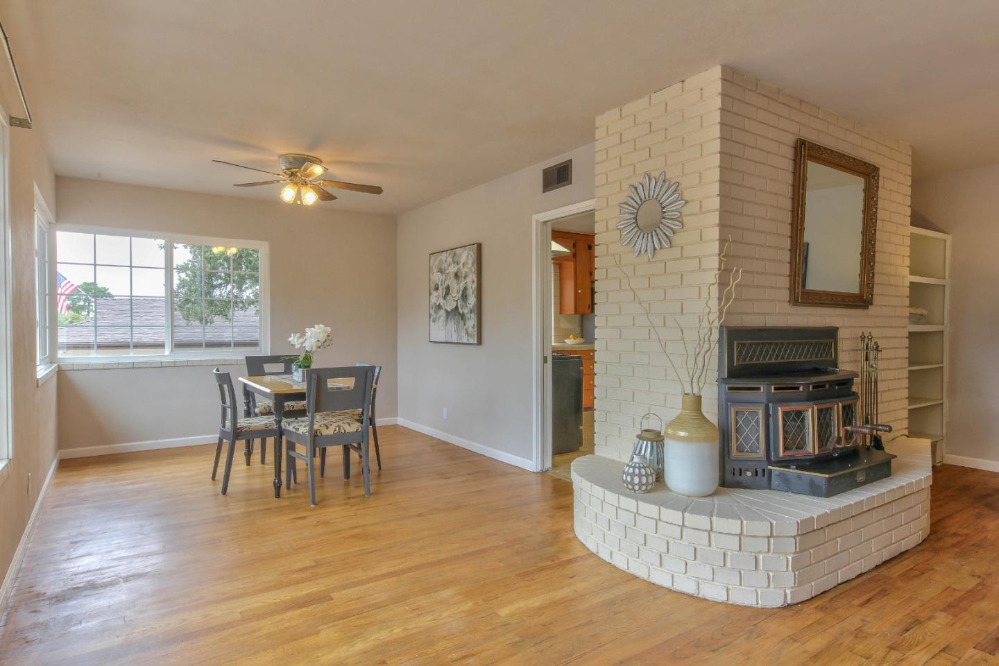 612 Sunset Drive Pacific Grove, CA 93950 - Photo 8 of 37 a living room with furniture and a dining table with kitchen view