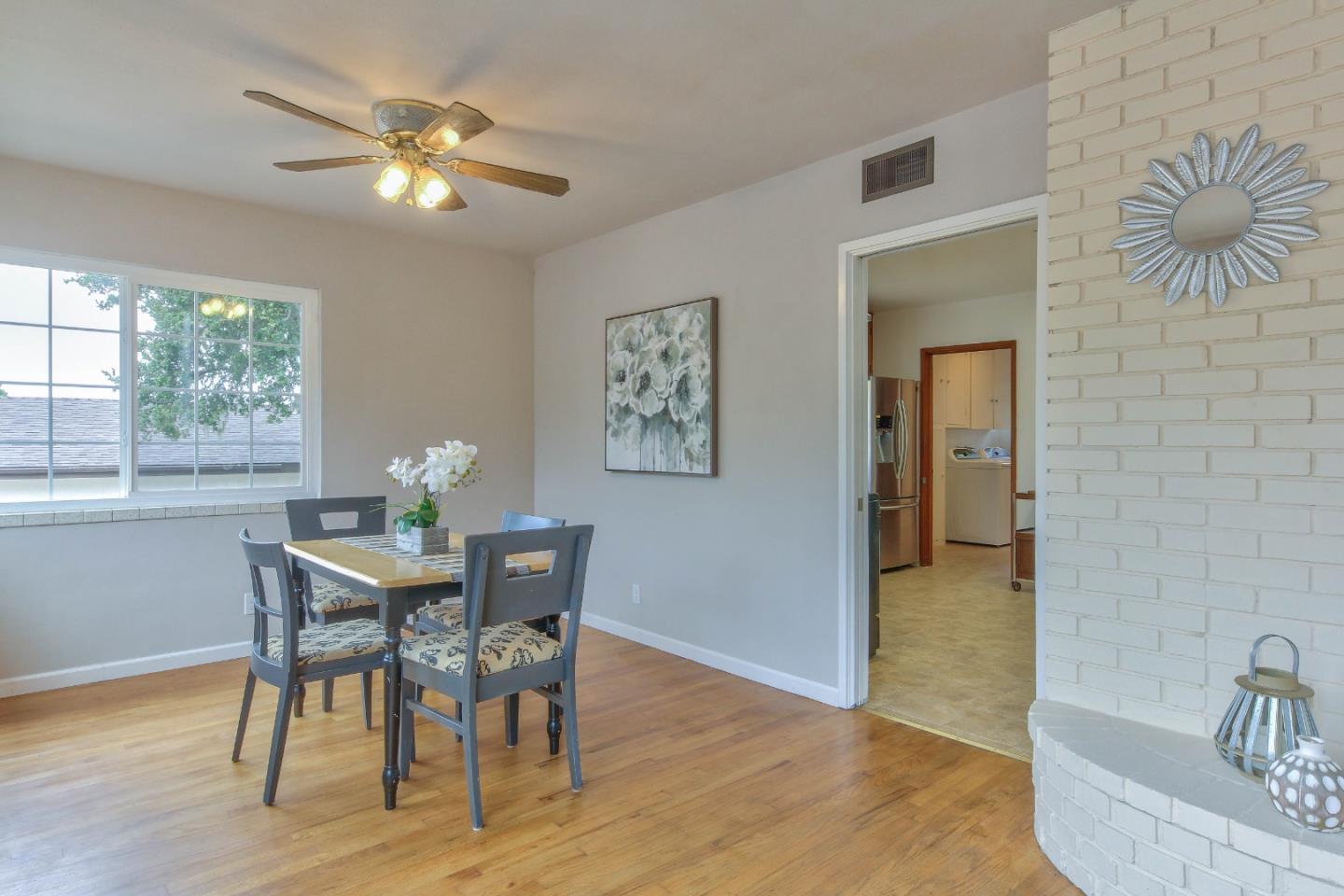 612 Sunset Drive Pacific Grove, CA 93950 - Photo 10 of 37 a view of a dining room with furniture and wooden floor