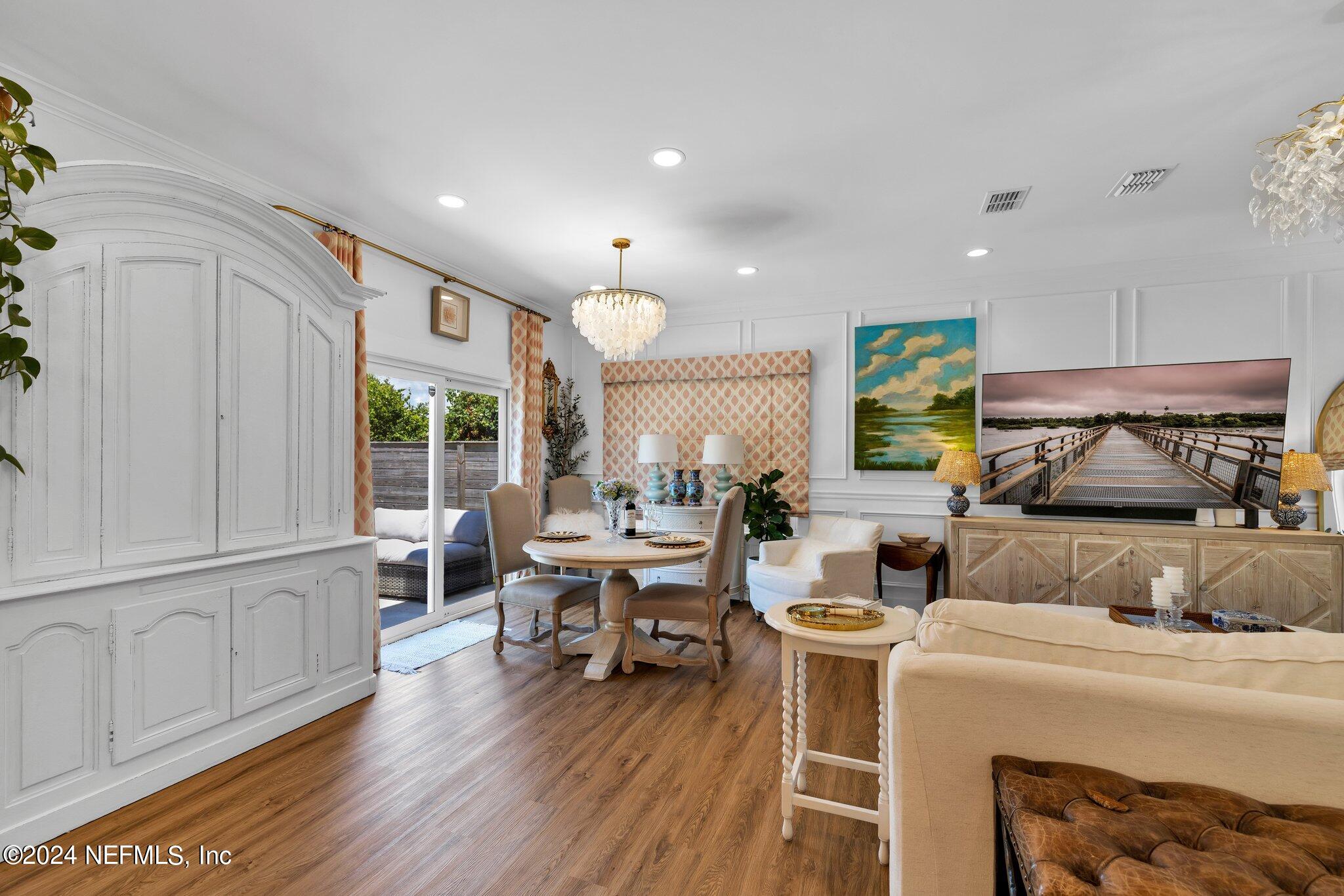 6825 A Ave Street St. Augustine, FL 32080 - Photo 11 of 53 a living room with furniture and a wooden floor