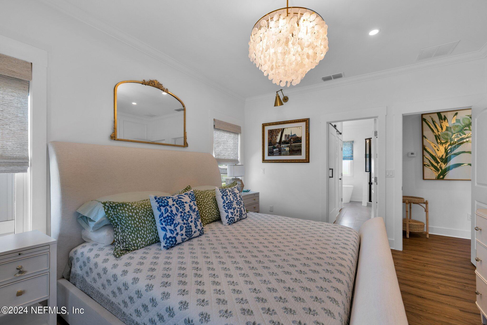 6825 A Ave Street St. Augustine, FL 32080 - Photo 22 of 53 a bedroom with a bed and wooden floor