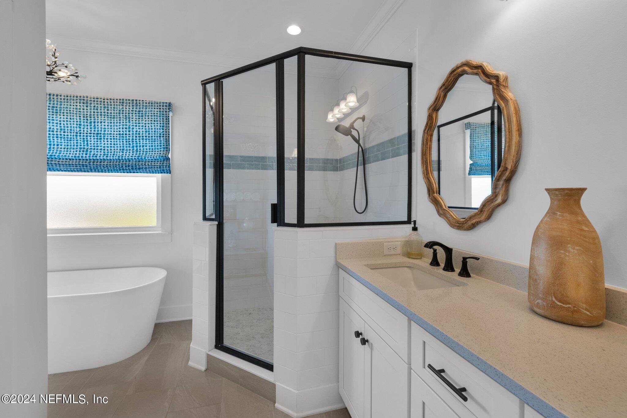 6825 A Ave Street St. Augustine, FL 32080 - Photo 24 of 53 a bathroom with a toilet a sink and a mirror