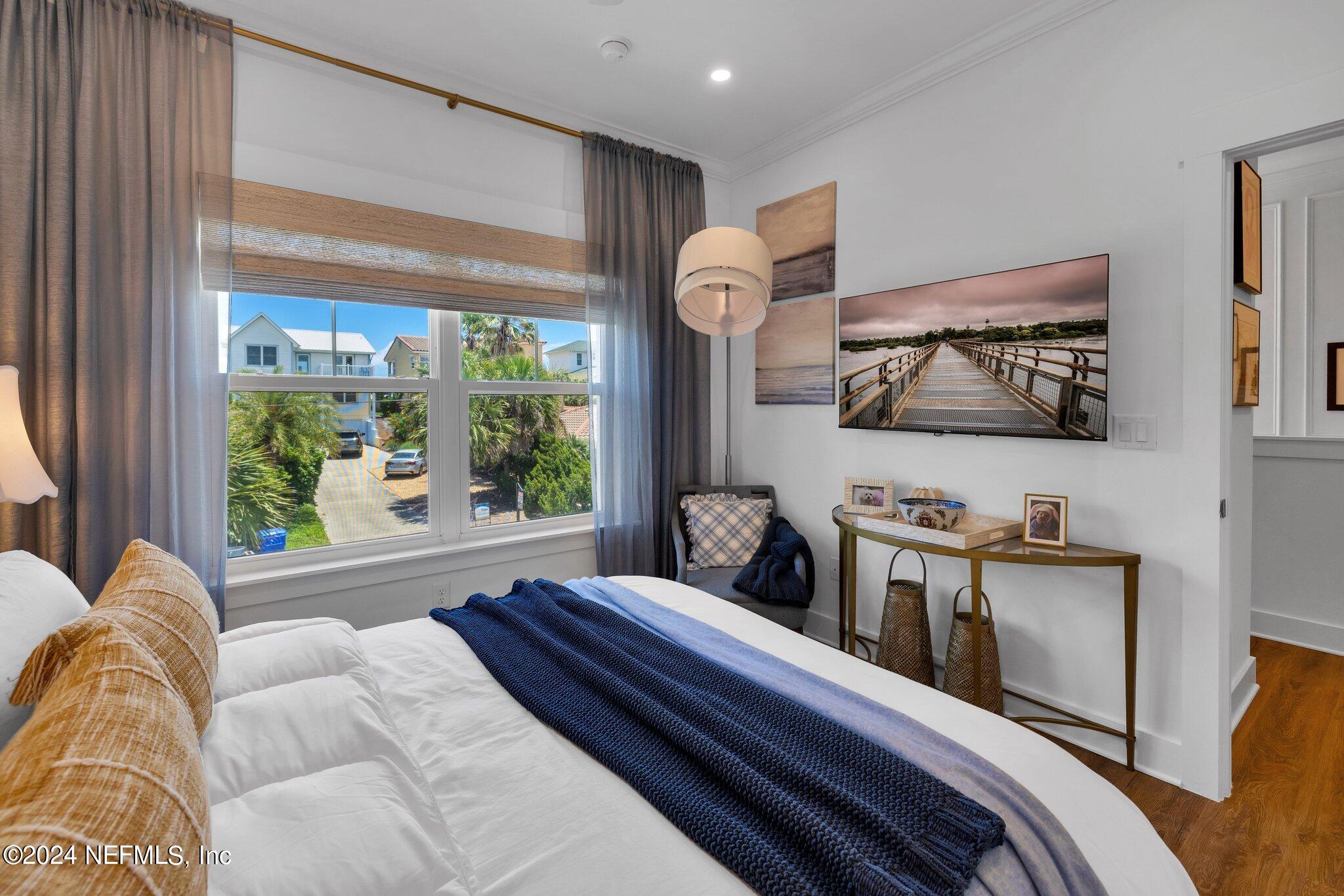 6825 A Ave Street St. Augustine, FL 32080 - Photo 34 of 53 a bedroom with furniture and a flat screen tv