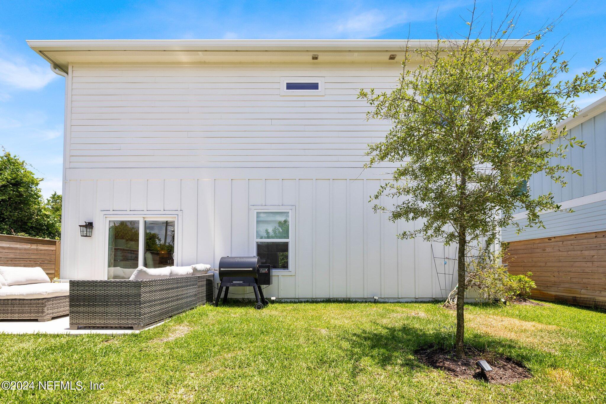 6825 A Ave Street St. Augustine, FL 32080 - Photo 5 of 53 a view of a house with backyard and sitting area