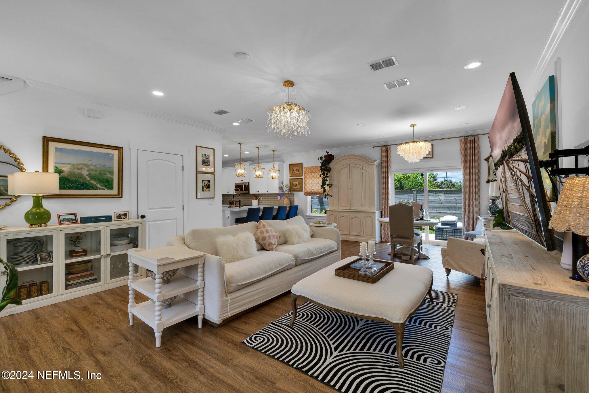 6825 A Ave Street St. Augustine, FL 32080 - Photo 6 of 53 a living room with furniture a flat screen tv and a rug