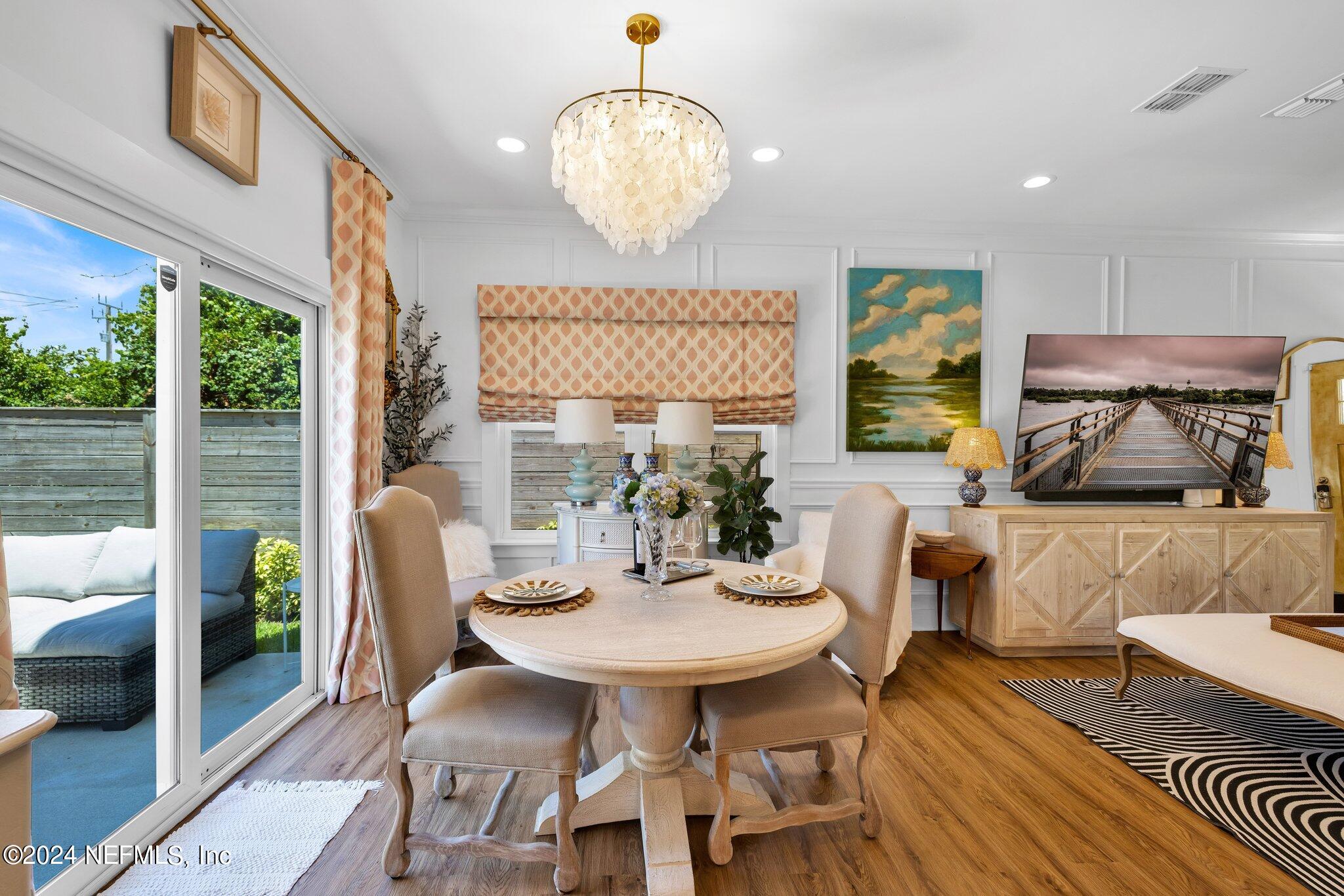 6825 A Ave Street St. Augustine, FL 32080 - Photo 10 of 53 a view of a dining room with furniture window and outside view
