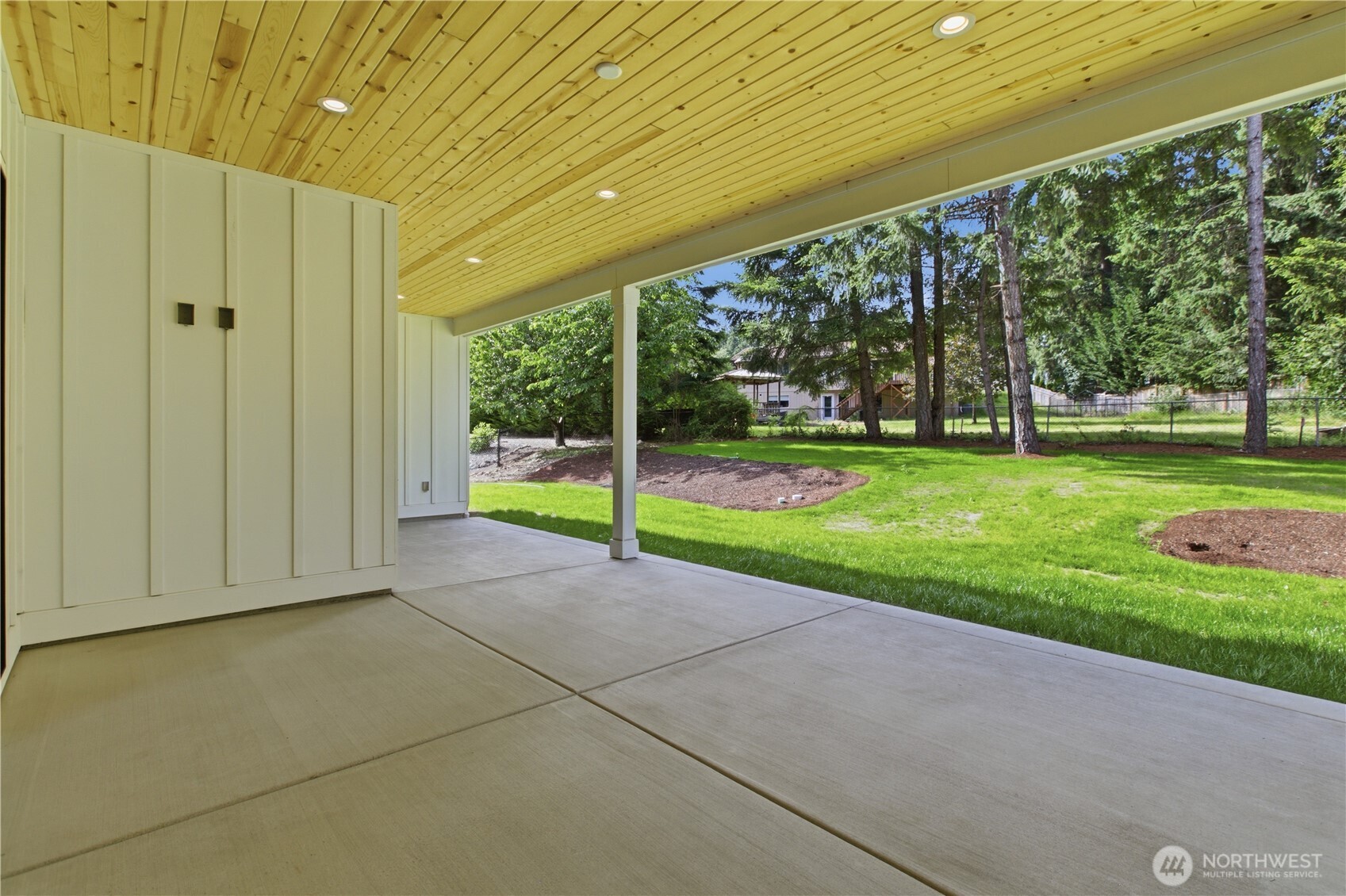 6709 254th Street East Graham, WA 98338 - Photo 34 of 40 a view of a house with backyard and porch