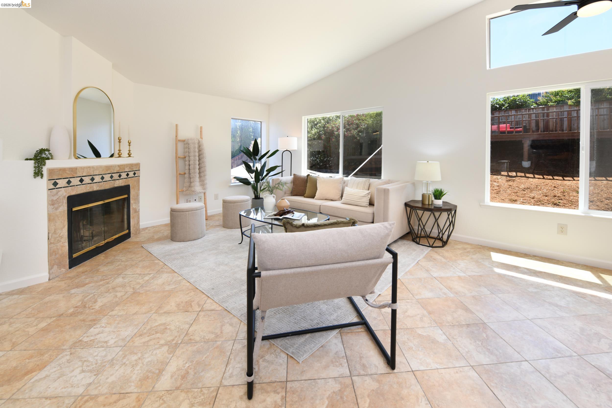 512 Burdick Drive Bay Point, CA 94565 - Photo 11 of 50 Vaulted ceilings enhance this living space featuring abundant natural light from large windows and a transom window