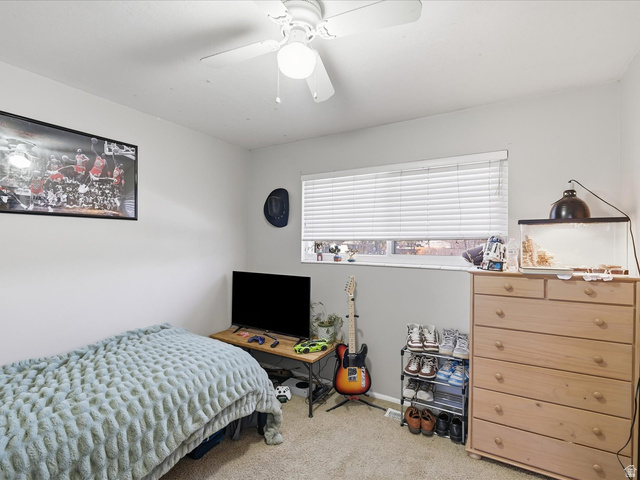 322 East 900 North Logan, UT 84321 - Photo 13 of 43 Bedroom with light colored carpet and a ceiling fan