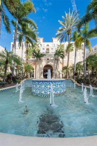 a view of living room with furniture and potted plant