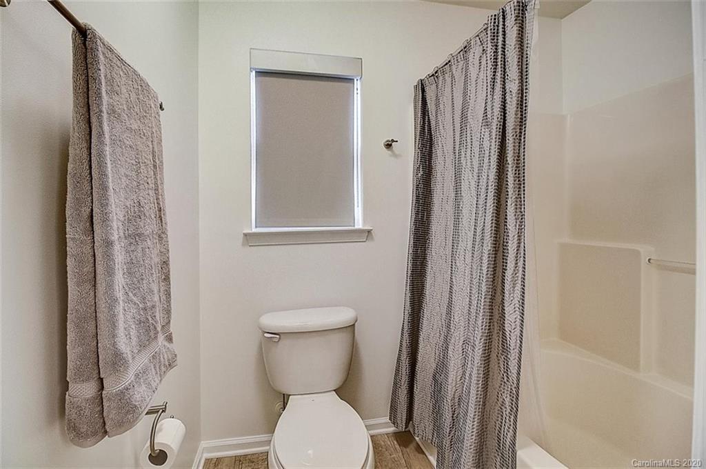 652 Raphael Place Charlotte, NC 28205 - Photo 12 of 26 a bathroom with a toilet and a sink
