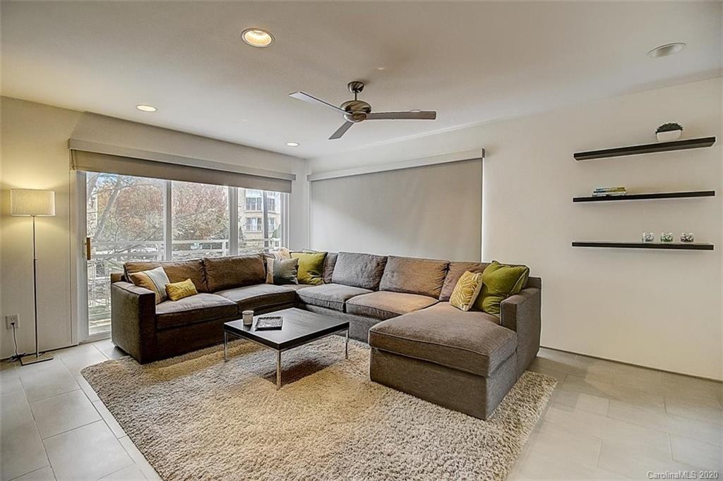 652 Raphael Place Charlotte, NC 28205 - Photo 3 of 26 a living room with furniture and a large window