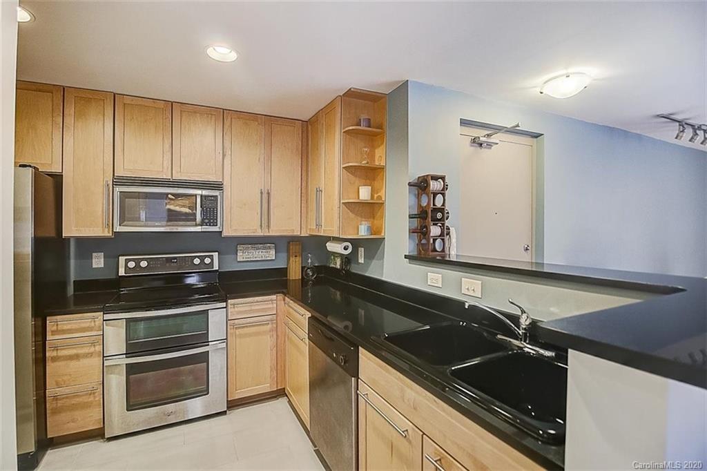 652 Raphael Place Charlotte, NC 28205 - Photo 6 of 26 a kitchen that has a sink and a stove