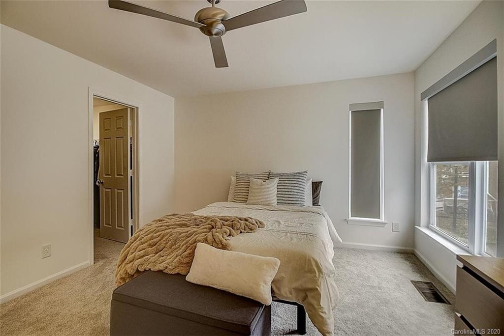 652 Raphael Place Charlotte, NC 28205 - Photo 10 of 26 a bedroom with a bed and a window