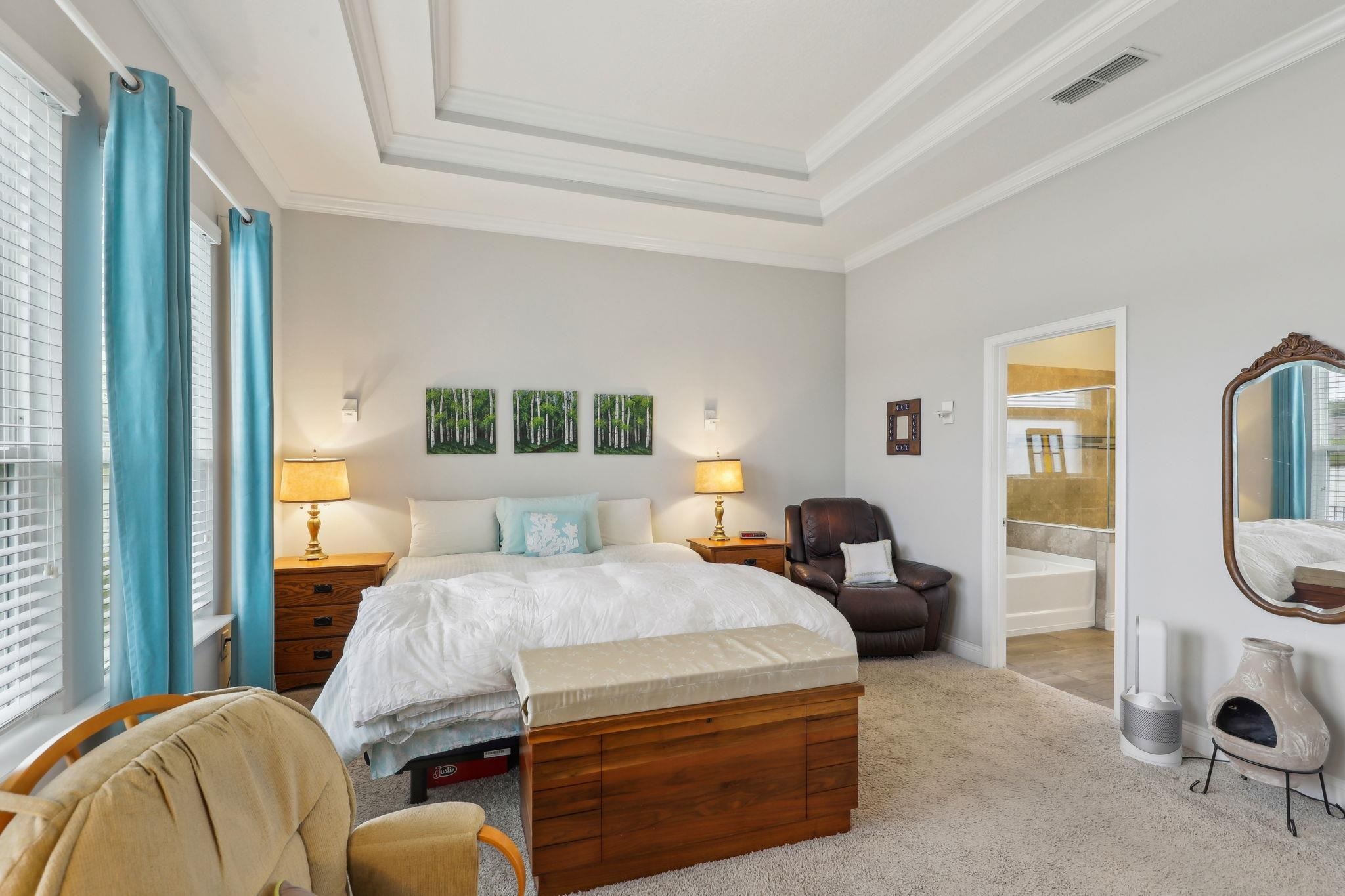 443 Sweet Mango Trail St. Augustine, FL 32086 - Photo 26 of 54 a bedroom with a bed a table and chair