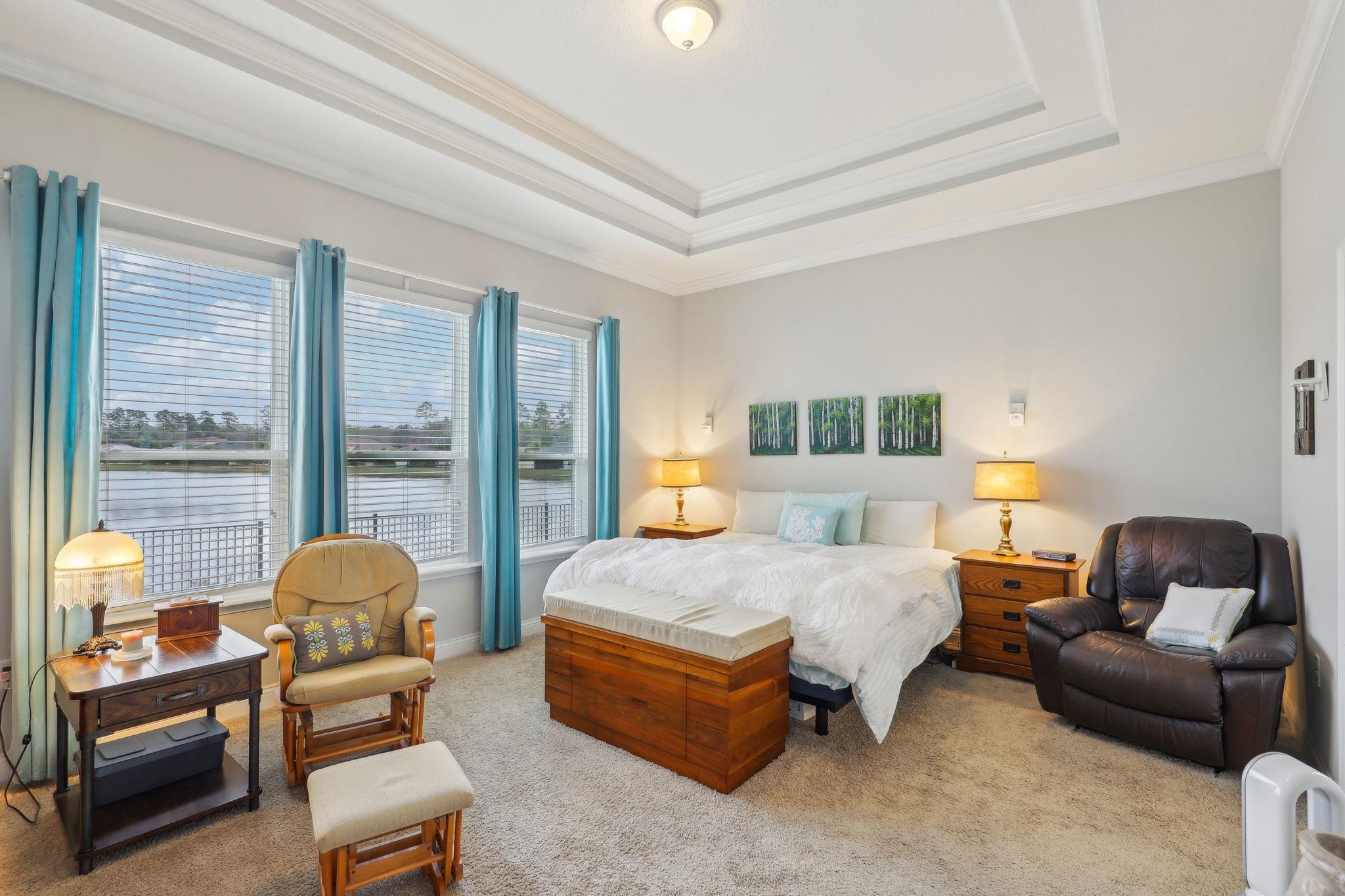 443 Sweet Mango Trail St. Augustine, FL 32086 - Photo 27 of 54 a bedroom with a bed and a couch