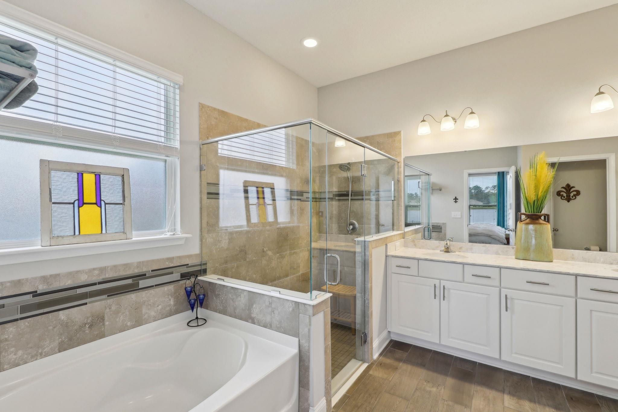 443 Sweet Mango Trail St. Augustine, FL 32086 - Photo 31 of 54 a bathroom with a sink and a bathtub