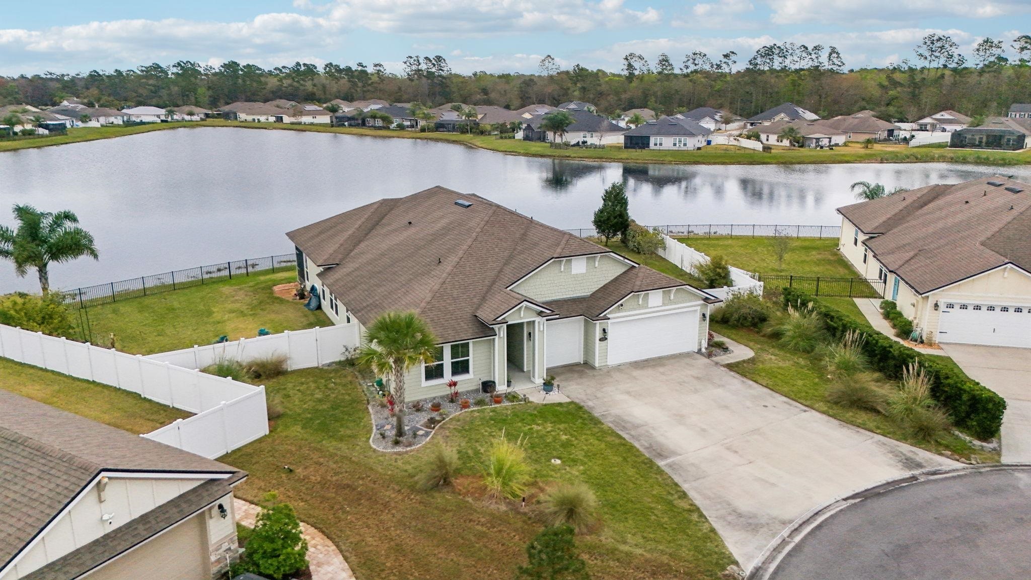 443 Sweet Mango Trail St. Augustine, FL 32086 - Photo 41 of 54 an aerial view of a house with a lake view