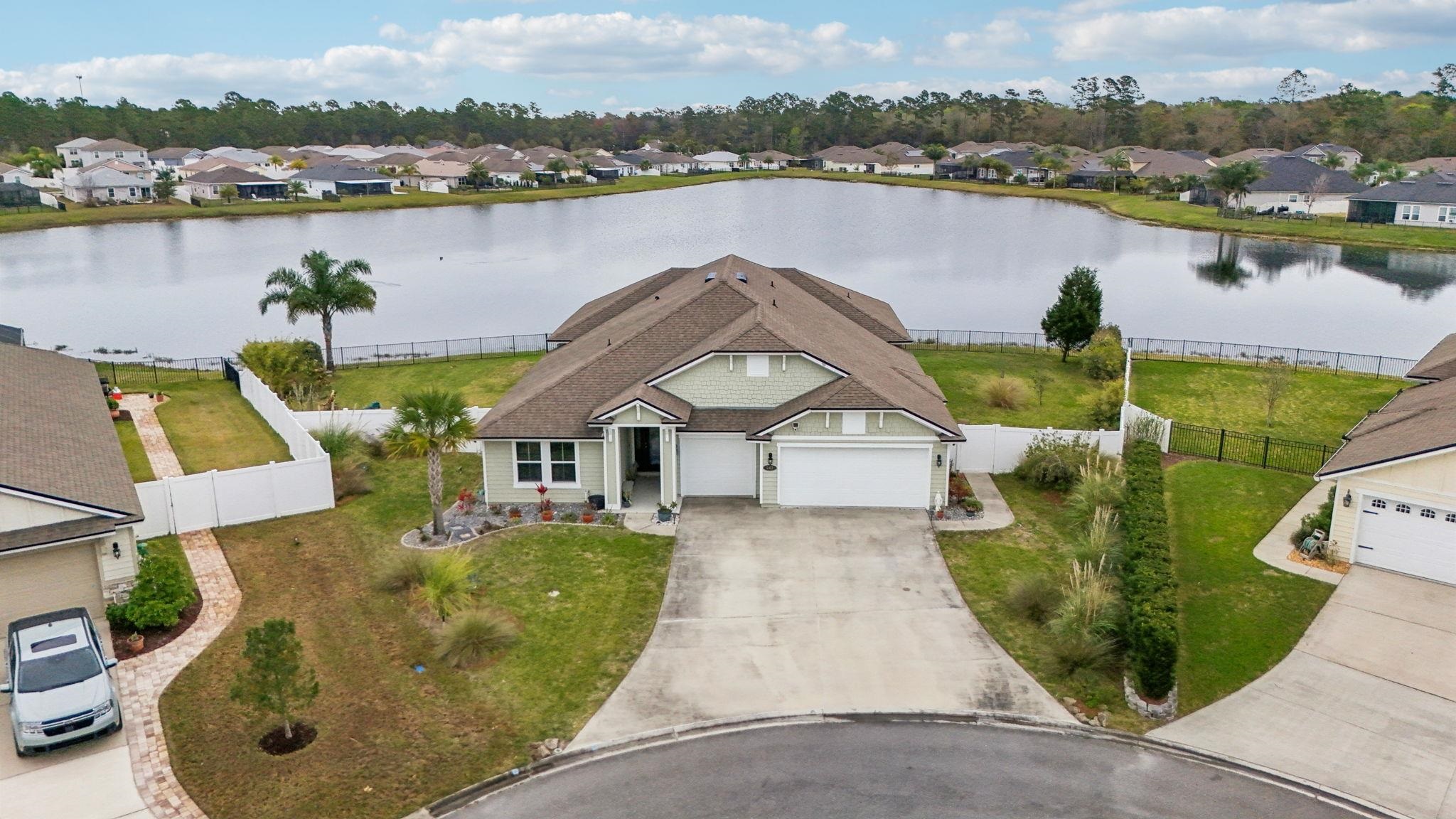 443 Sweet Mango Trail St. Augustine, FL 32086 - Photo 45 of 54 an aerial view of a house with outdoor space and lake view