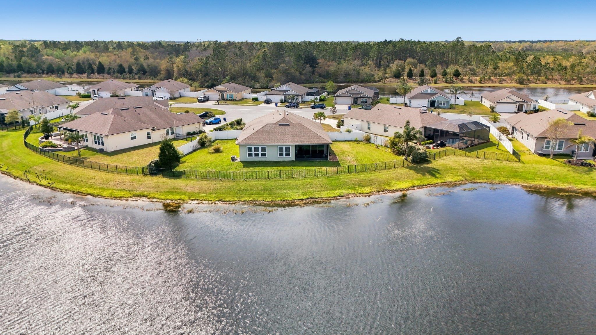 443 Sweet Mango Trail St. Augustine, FL 32086 - Photo 52 of 54 a view of a swimming pool with a yard