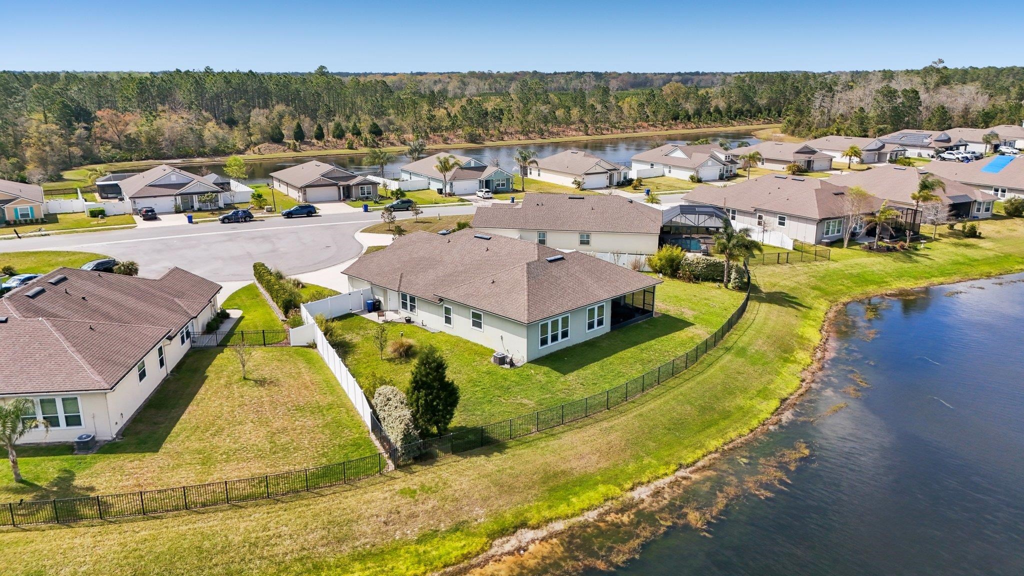 443 Sweet Mango Trail St. Augustine, FL 32086 - Photo 54 of 54 a view of a swimming pool with a lake view