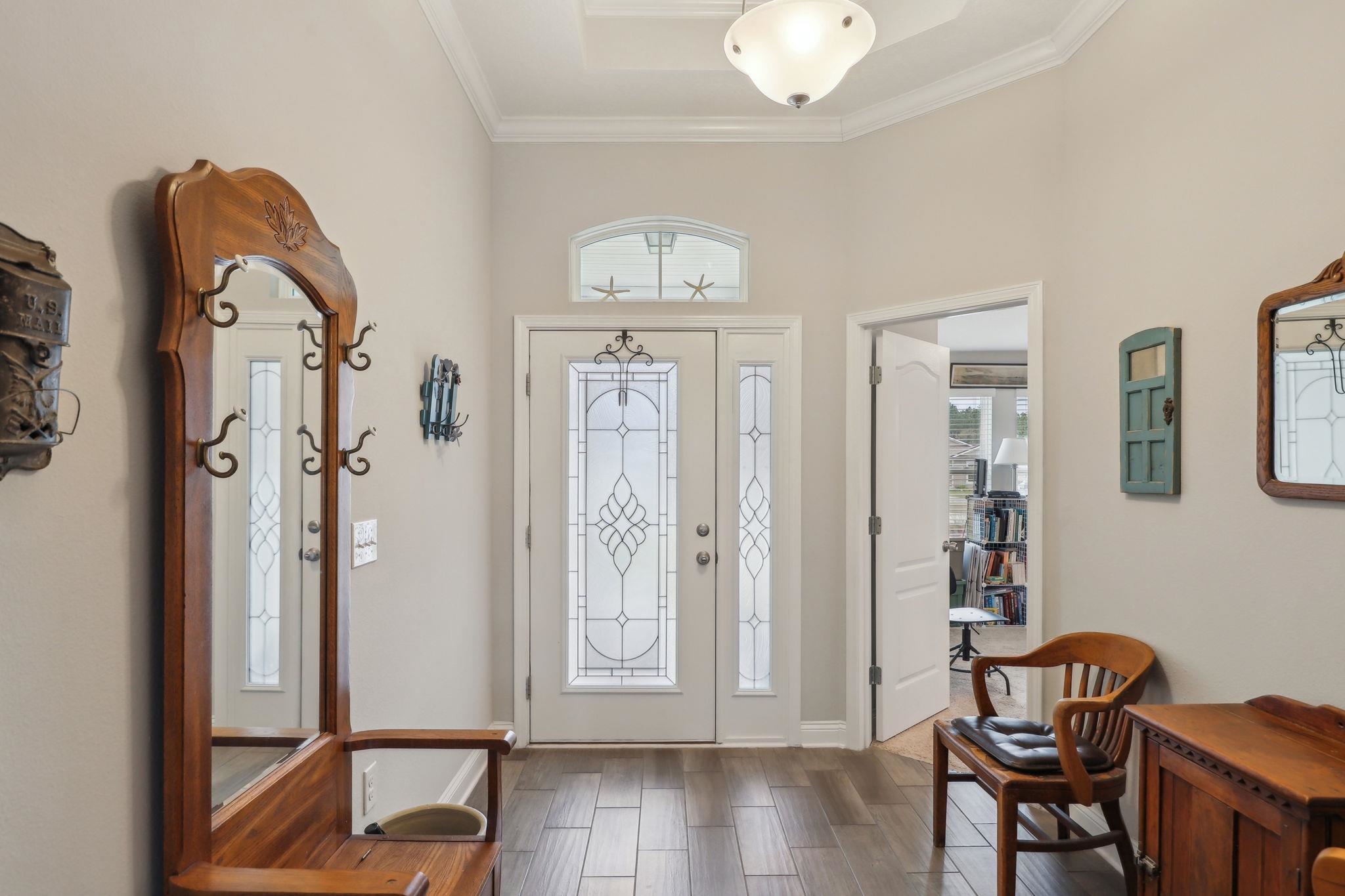 443 Sweet Mango Trail St. Augustine, FL 32086 - Photo 7 of 54 a view of a livingroom with wooden floor and a dining table