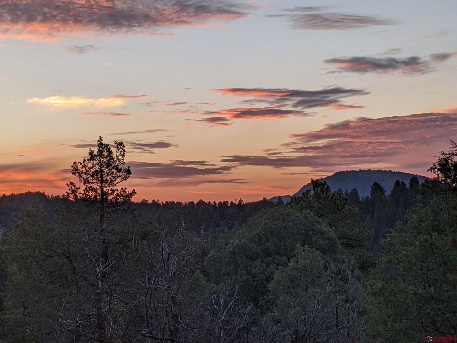 285 Logging Trail Road Durango, CO 81303 - Photo 1 of 23 a view of sunset and lake