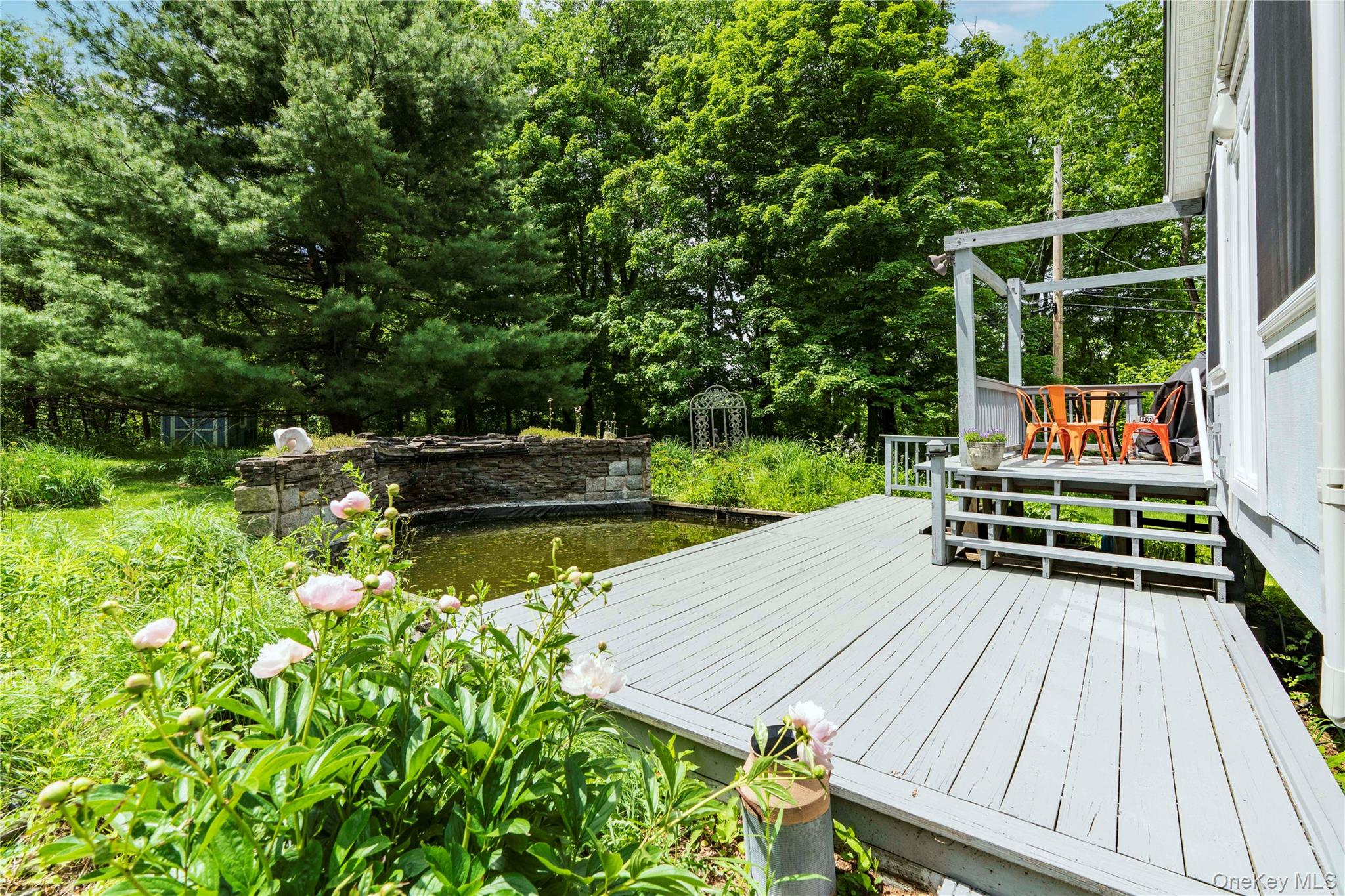 10 Pilgrims Progress Road Rhinebeck, NY 12572 - Photo 7 of 31 The Extensive Decking Overlooks the Rock Garden and Koi Pond