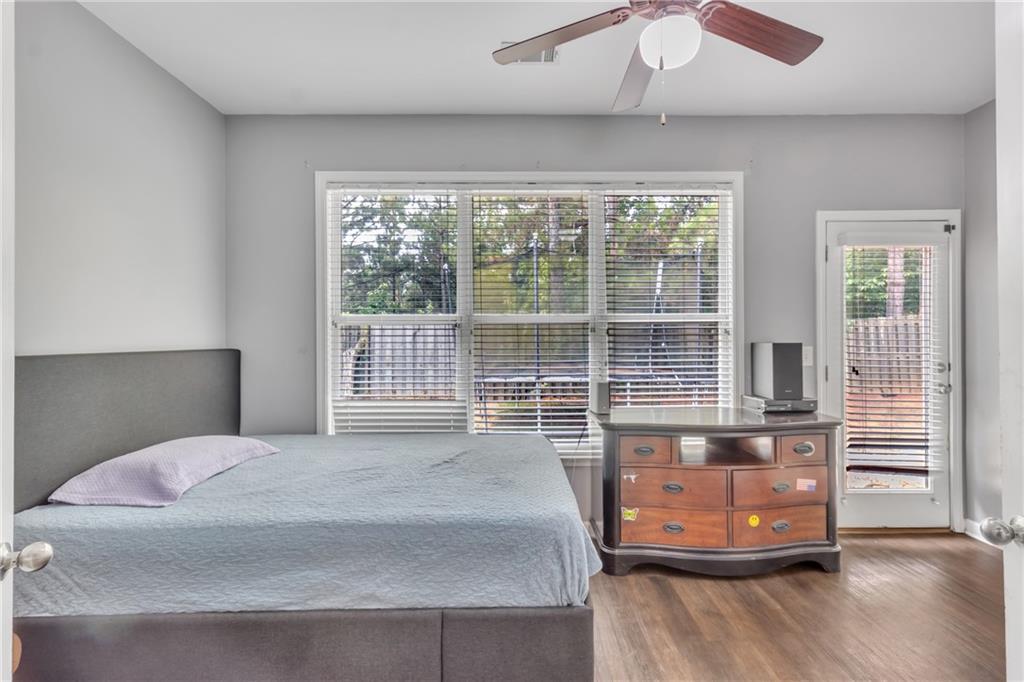 4044 Amberleigh Trace Gainesville, GA 30507 - Photo 16 of 22 a bedroom with a bed and wooden floor