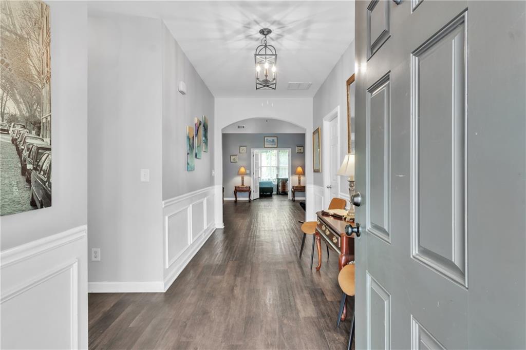 4044 Amberleigh Trace Gainesville, GA 30507 - Photo 3 of 22 a view of a hallway view with furniture and wooden floor