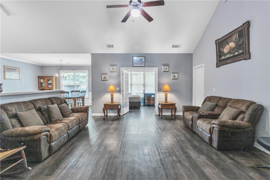 4044 Amberleigh Trace Gainesville, GA 30507 - Photo 8 of 22 a living room with furniture and wooden floor