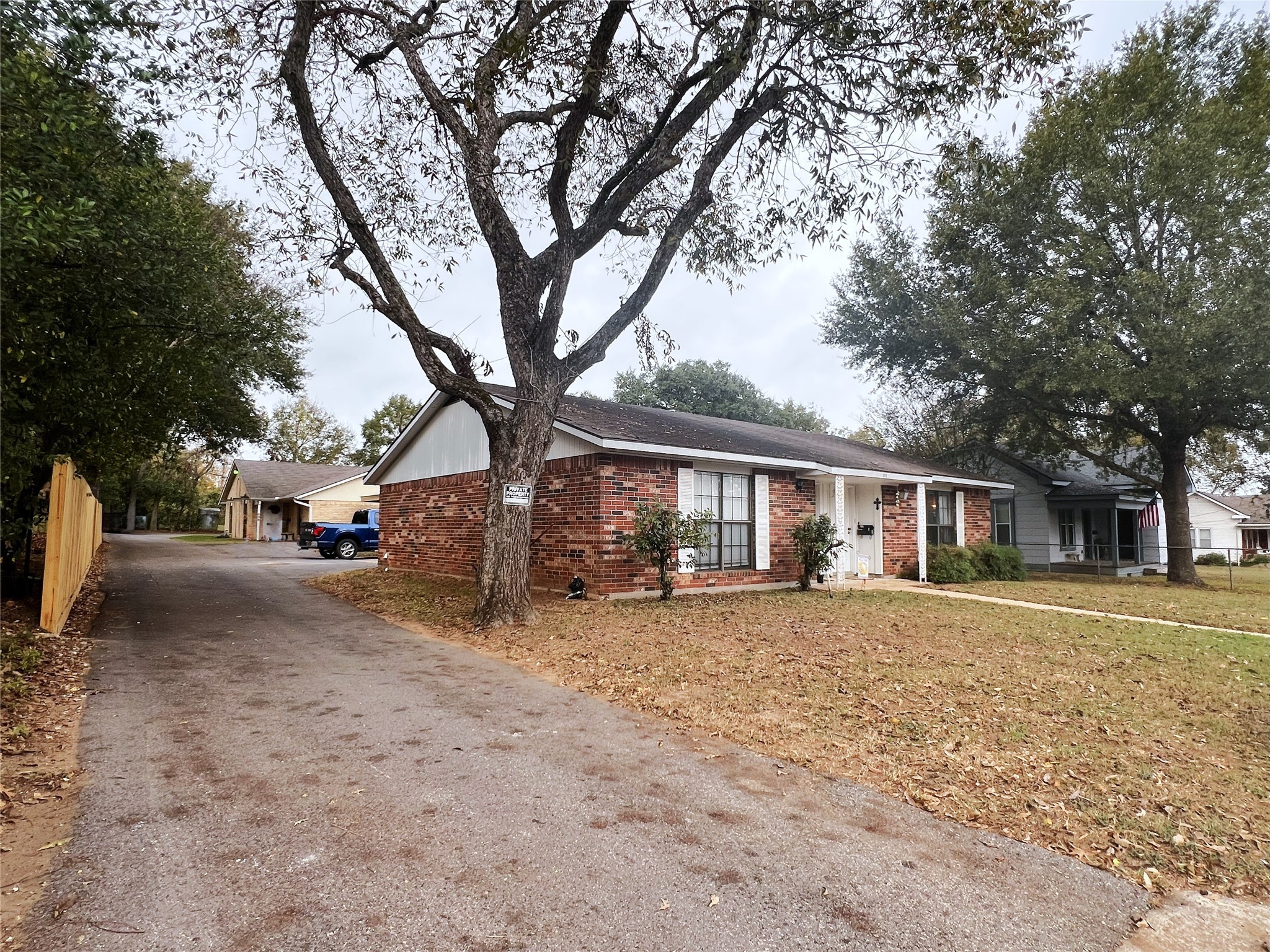 602 South Jackson Street Brenham, TX 77833 - Photo 2 of 12 a view of a yard in front of a house
