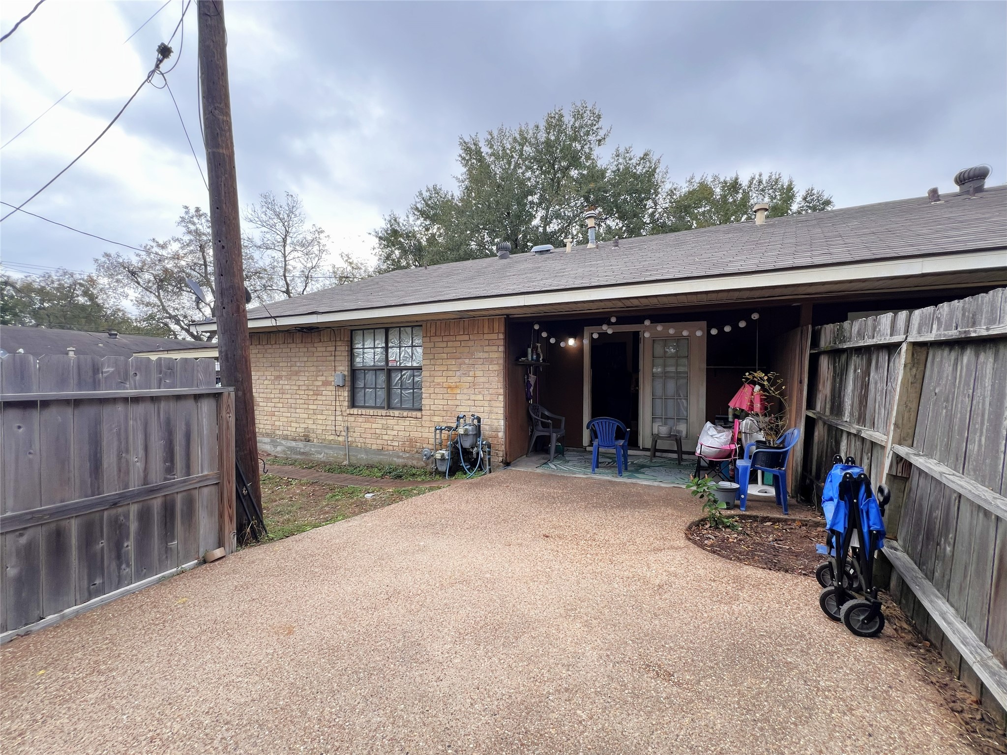 602 South Jackson Street Brenham, TX 77833 - Photo 9 of 12 a view of a house with a porch and furniture