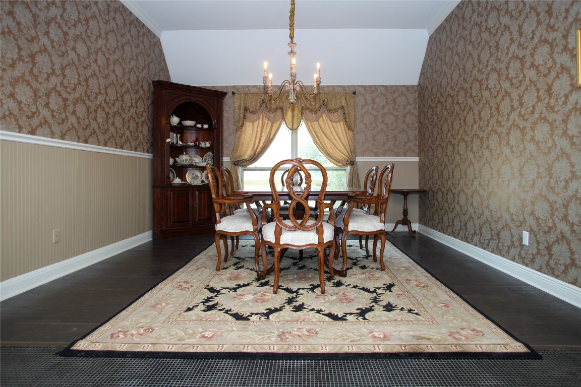 1589 Cool Spring Way Austin, TX 78737 - Photo 14 of 35 a view of a dining room with furniture and chandelier