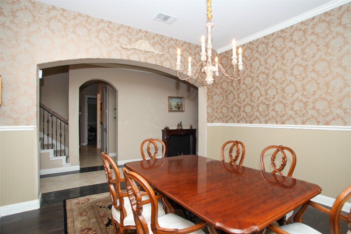 1589 Cool Spring Way Austin, TX 78737 - Photo 15 of 35 a view of a dining room with furniture and wooden floor