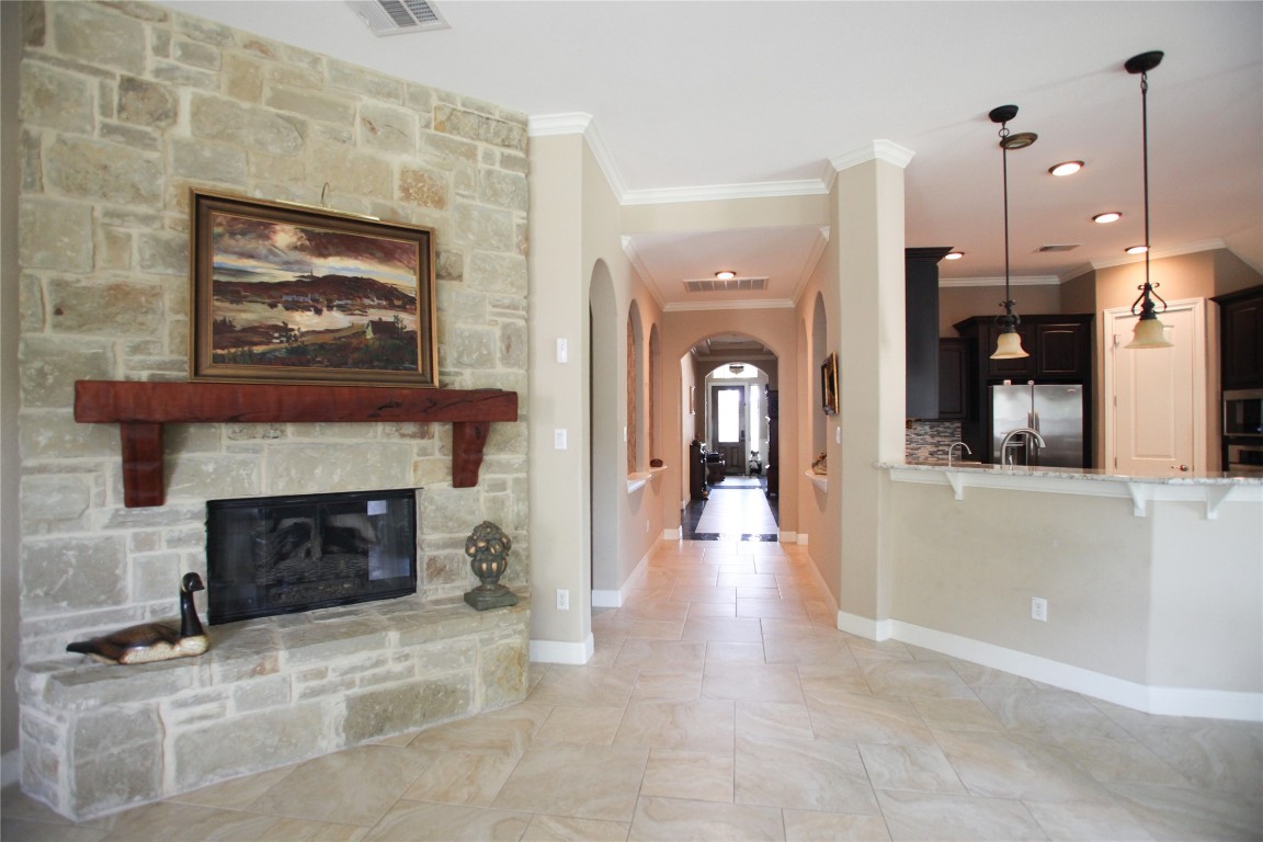 1589 Cool Spring Way Austin, TX 78737 - Photo 16 of 35 a living room with furniture and a fireplace