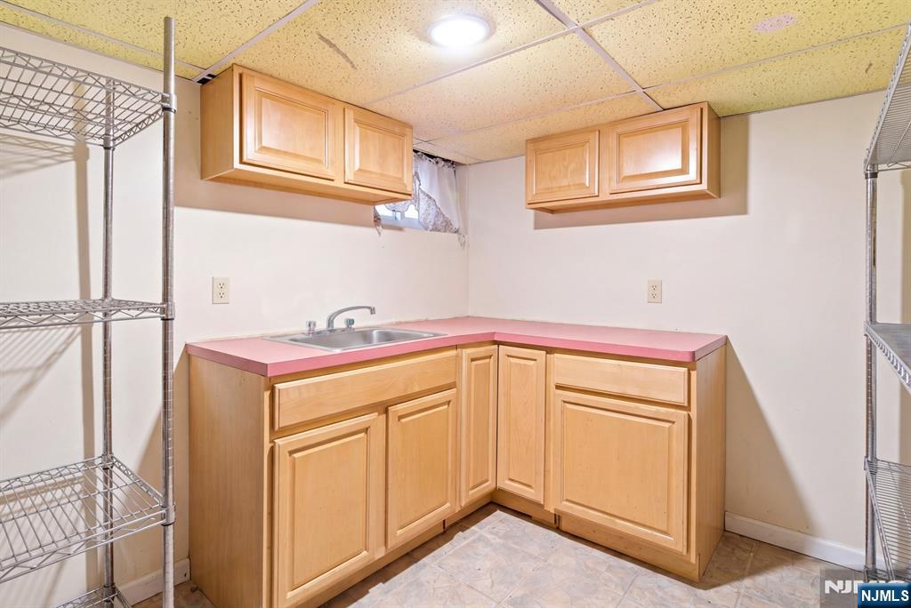 73-75 Knickerbocker Avenue Paterson, NJ 07503 - Photo 11 of 27 a utility room with a sink a washer and dryer