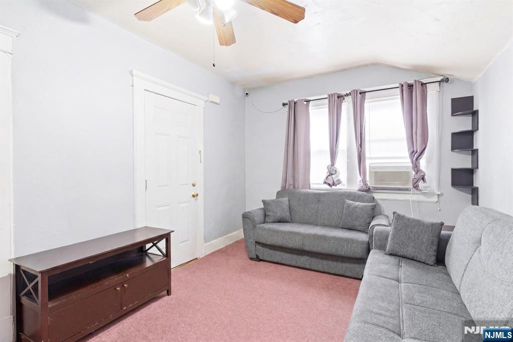 73-75 Knickerbocker Avenue Paterson, NJ 07503 - Photo 19 of 27 a living room with furniture and a window