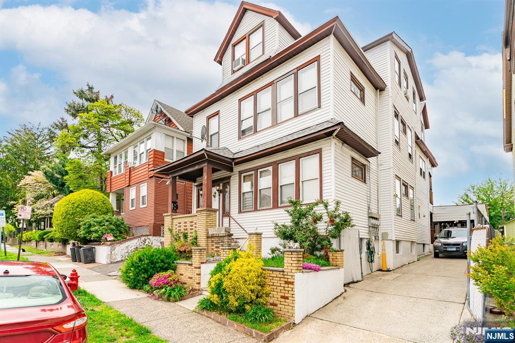 73-75 Knickerbocker Avenue Paterson, NJ 07503 - Photo 2 of 27 a front view of a house