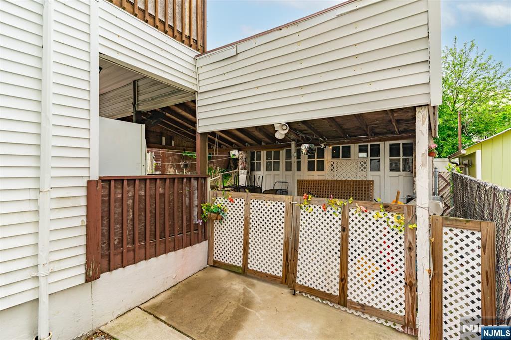 73-75 Knickerbocker Avenue Paterson, NJ 07503 - Photo 25 of 27 a view of a house with a iron gate