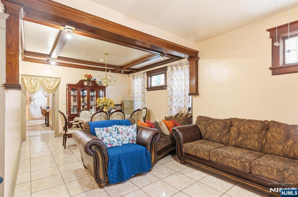 73-75 Knickerbocker Avenue Paterson, NJ 07503 - Photo 6 of 27 a living room with furniture and a large window
