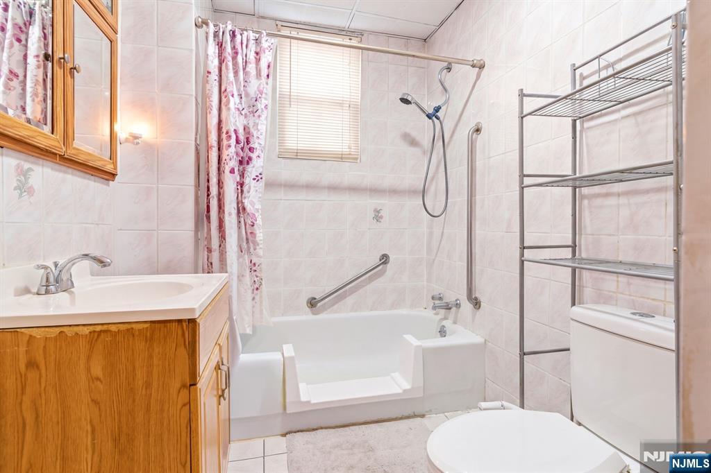 73-75 Knickerbocker Avenue Paterson, NJ 07503 - Photo 8 of 27 a bathroom with a sink toilet and shower