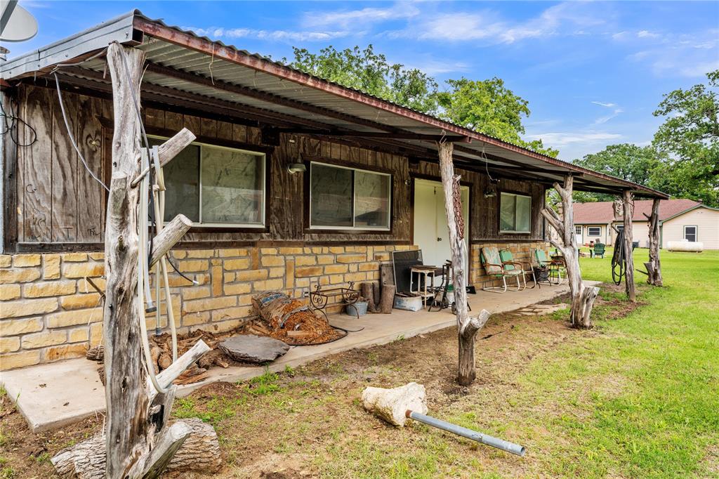 209 Dixie Road Millsap, TX 76066 - Photo 11 of 31 a view of a house with backyard