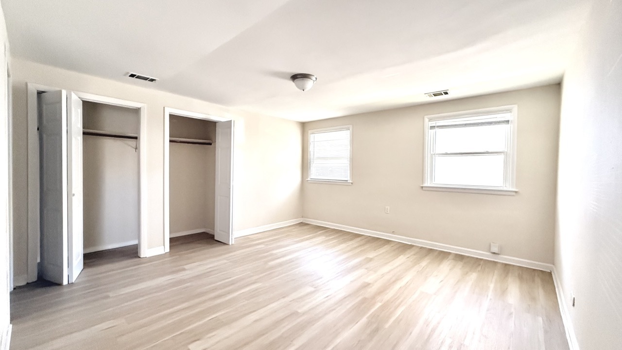 1828 183rd Street Homewood, IL 60430 - Photo 15 of 21 an empty room with wooden floor and windows